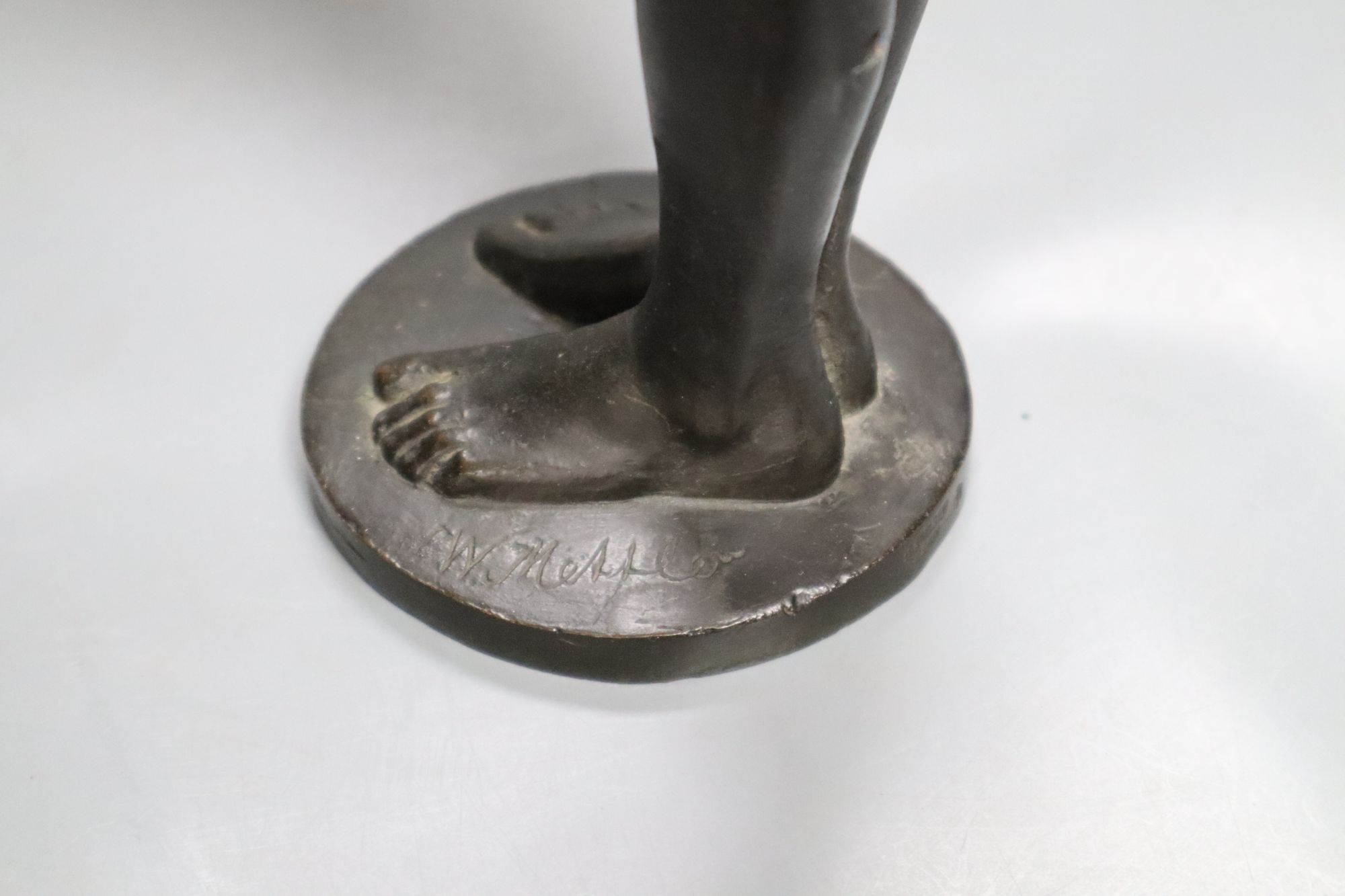 A bronze of a girl with bowl, signed W. Mellor, height 39cm